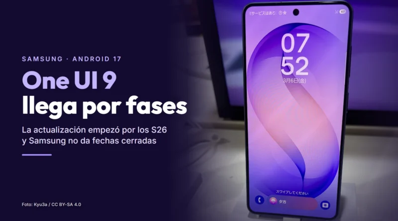 Un Samsung Galaxy S26 encendido en el expositor de una tienda, junto al texto «One UI 9 llega por fases»
